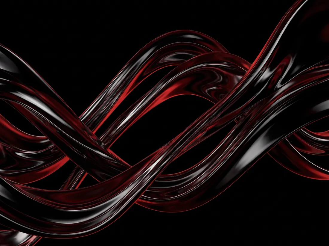 Twisting ribbons of liquid chrome catching deep red light.